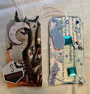 tags
Baby tag and Fall tag
Keywords: book pages;gesso, ink;stencil;gems;circle paper punch;hearts;bats;whale;fish;moon;tree;gems;pop dots;stars